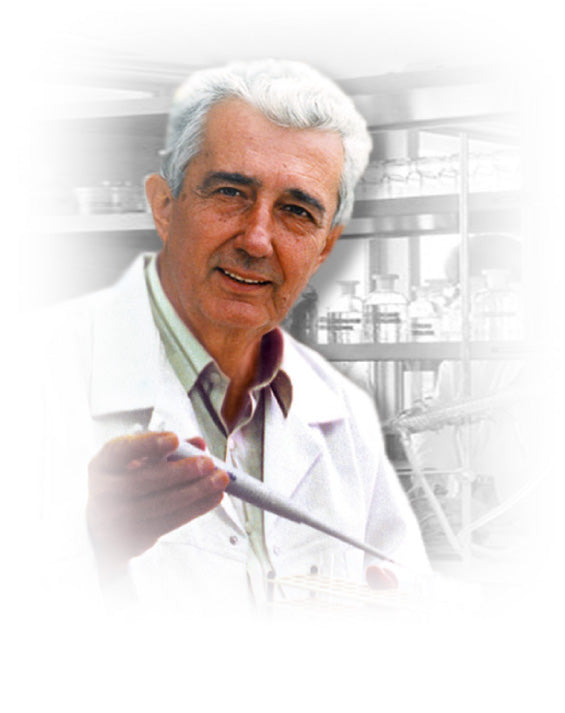 Mirko Beljanski, PhD, in his laboratory holding a pipette