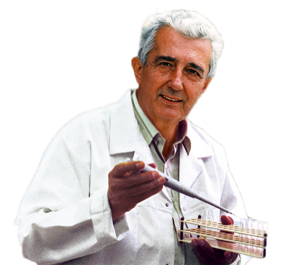 Mirko Beljanski, PhD, in his laboratory holding a pipette
